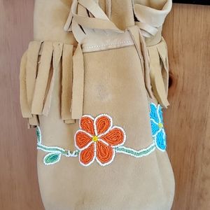 Vintage handcrafted deerskin bucket bag.